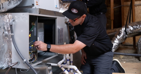 technician working on heating system