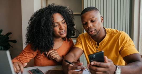 couple calculating savings