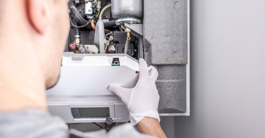 technician working on heating system